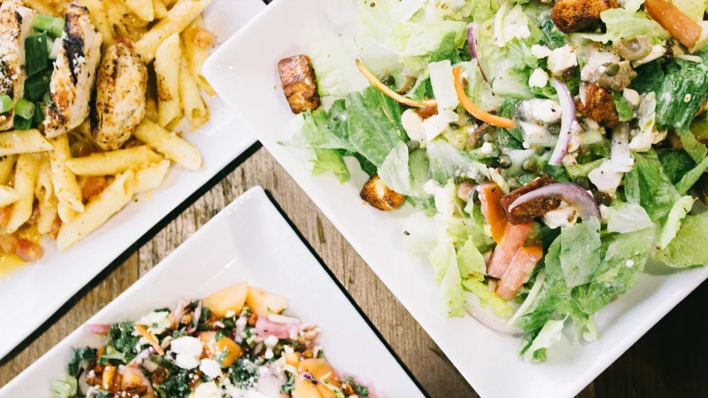Greek salad and pasta entree available at Drift On Grand restaurant in Grove, OK